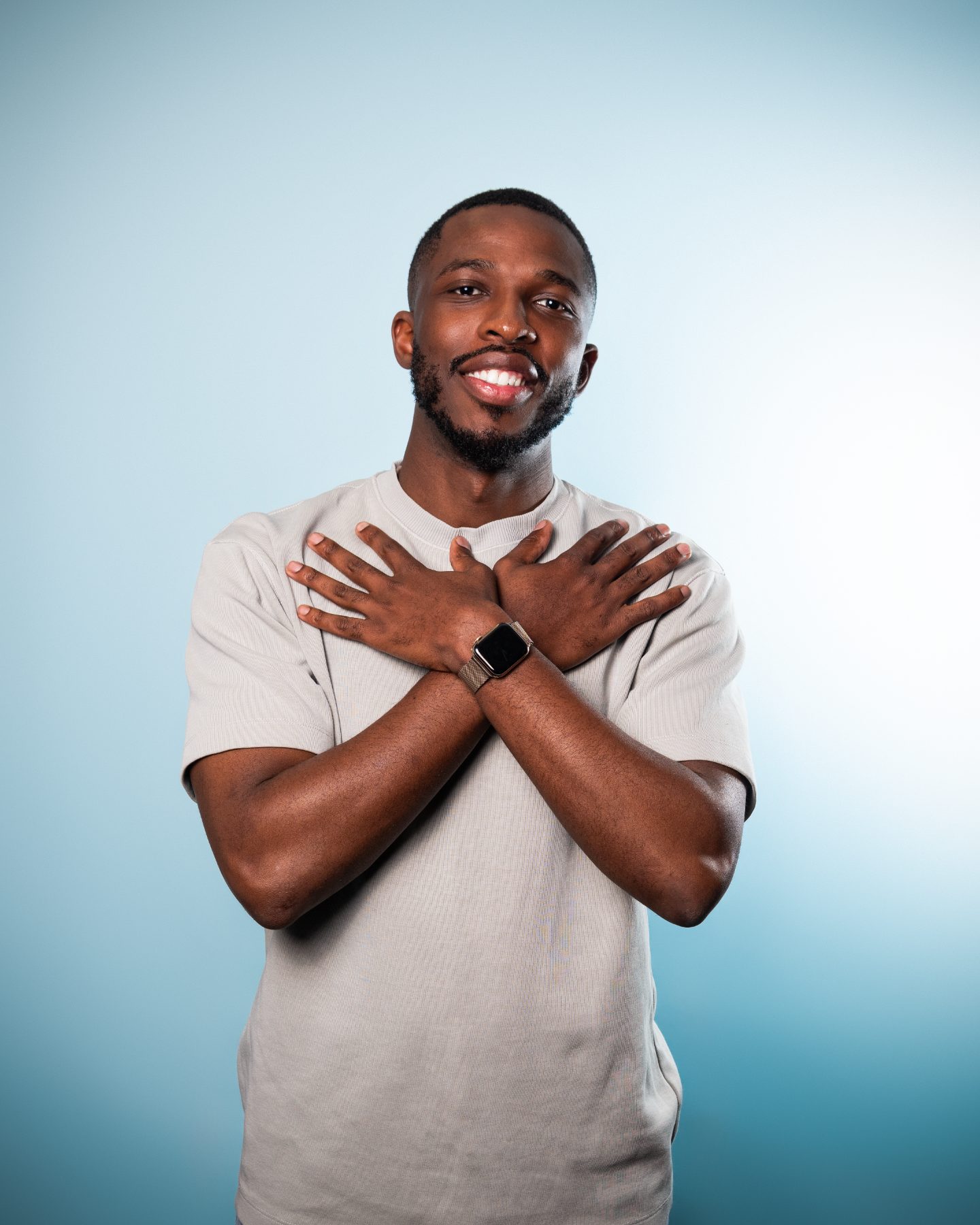 Washington smiling, hands crossed over his chest